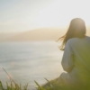 lady looking at beach sunset