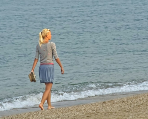 lady walking at the beach