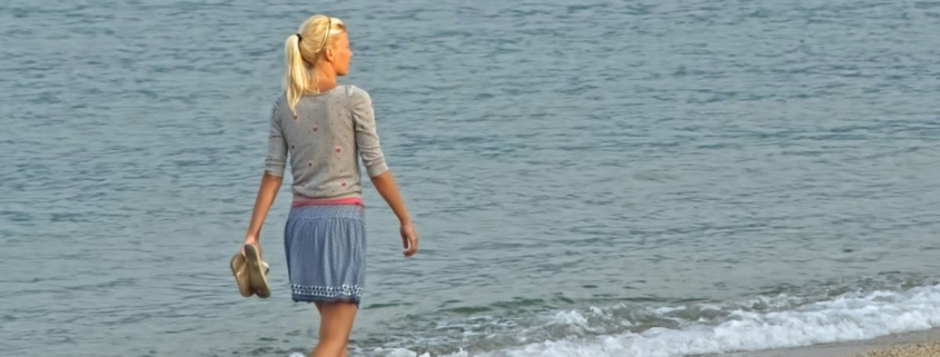 lady walking at the beach